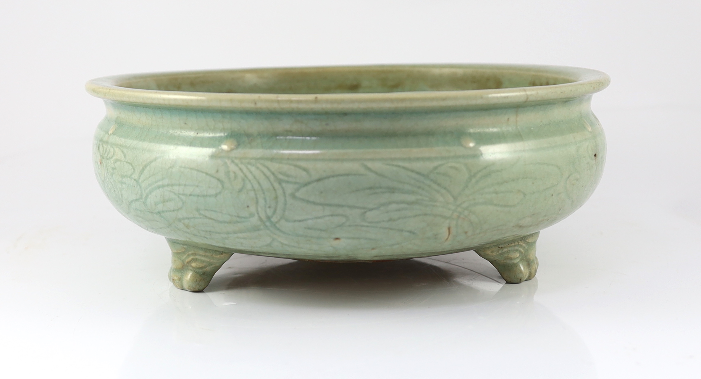 A large Chinese Longquan celadon ‘magnolia’ tripod censer, Ming dynasty